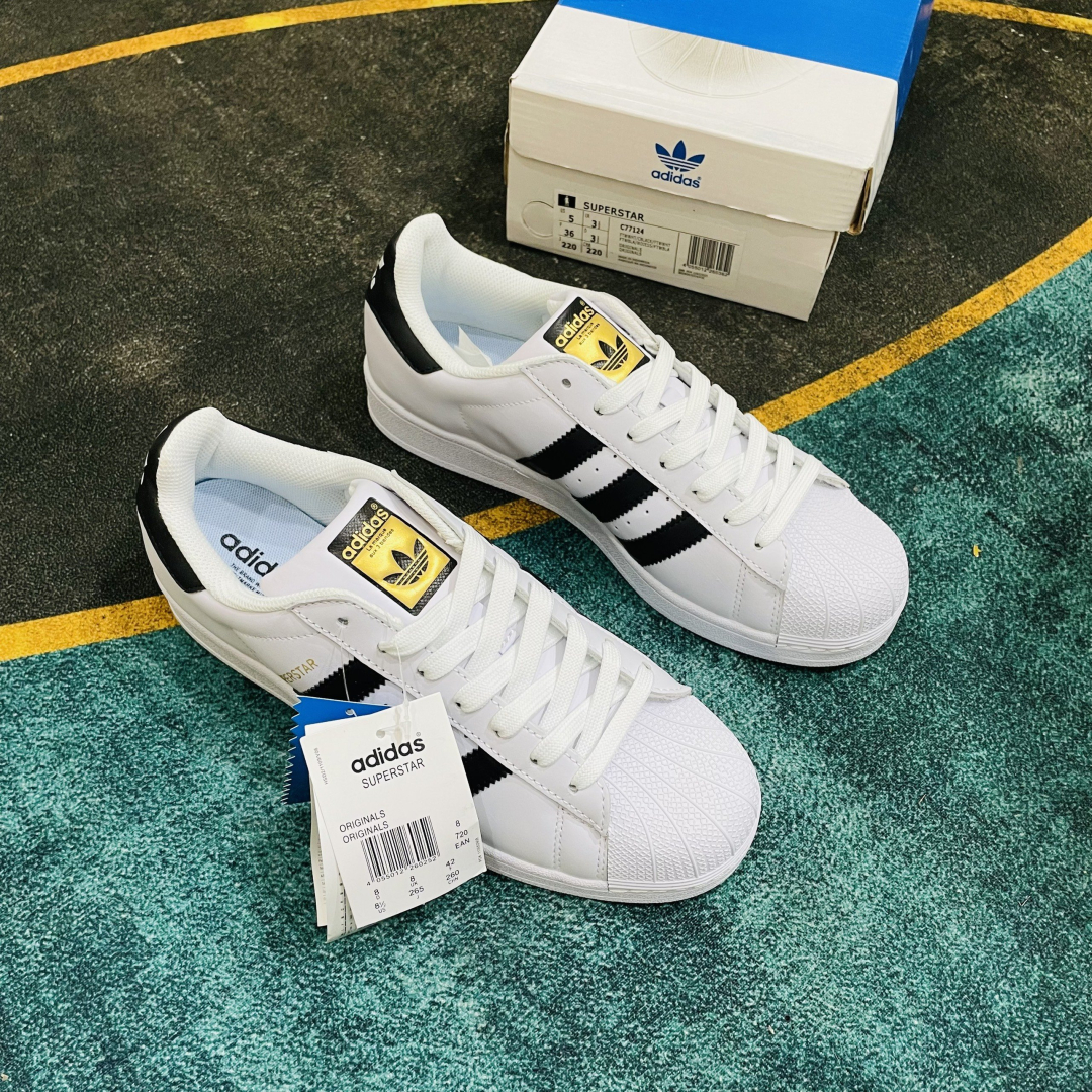 Adidas trắng sọc đen